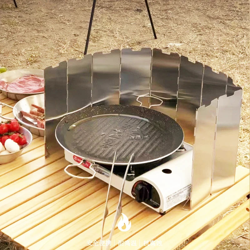 A portable outdoor camping foldable gas stove with windproof aluminium shield, ideal for enhancing outdoor cooking experiences. Lightweight yet durable, it features built-in pegs for ground securing, and comes with a handy carry bag. Ideal for camping, hiking, or picnicking, it can fit easily in the pocket, and helps save on fuel by protecting the flame from wind. Available in sleek silver color and multiple sizes. Package includes one windshield screen and one carry bag.