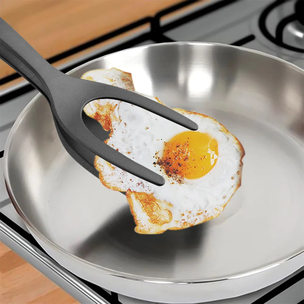 A versatile 2-in-1 Nylon Grip Flip Tongs used for flipping pancakes, fried eggs, or grilling steaks safely and efficiently, created from high-quality, heat-resistant materials boasting a unique nylon grip for safety and comfort, with a specialized clamp mechanism for easy control and perfect for anyone from experienced chefs to cooking enthusiasts, redefining kitchen convenience.