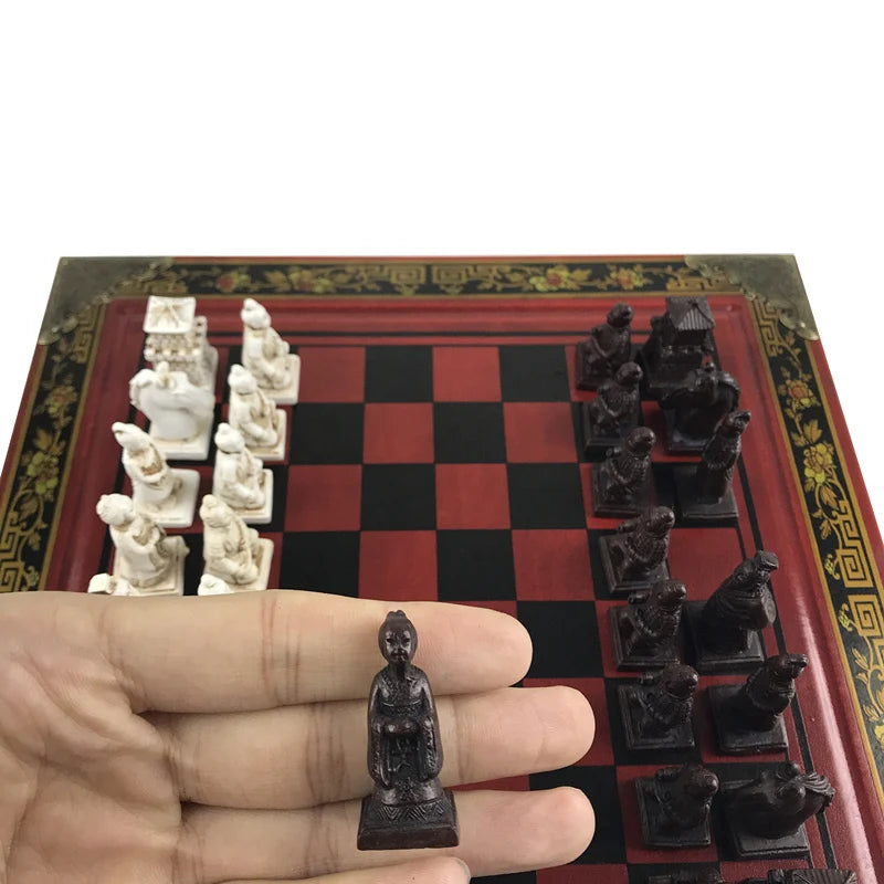 A beautifully crafted Terracotta Warriors Chess Set, with perfectly polished, hand-painted, and resin-cast pieces. Each character, from the dominating King and powerful Queen to the assorted ranks of Bishop, Knight, Rook, and Pawn, exudes unique regality and charm. The high-density board paste skin makes the chessboard not only sturdy and durable but also nourishes a luxurious feel. With its vibrant colors and lifelike decorations, the set gets an appealing aesthetic touch