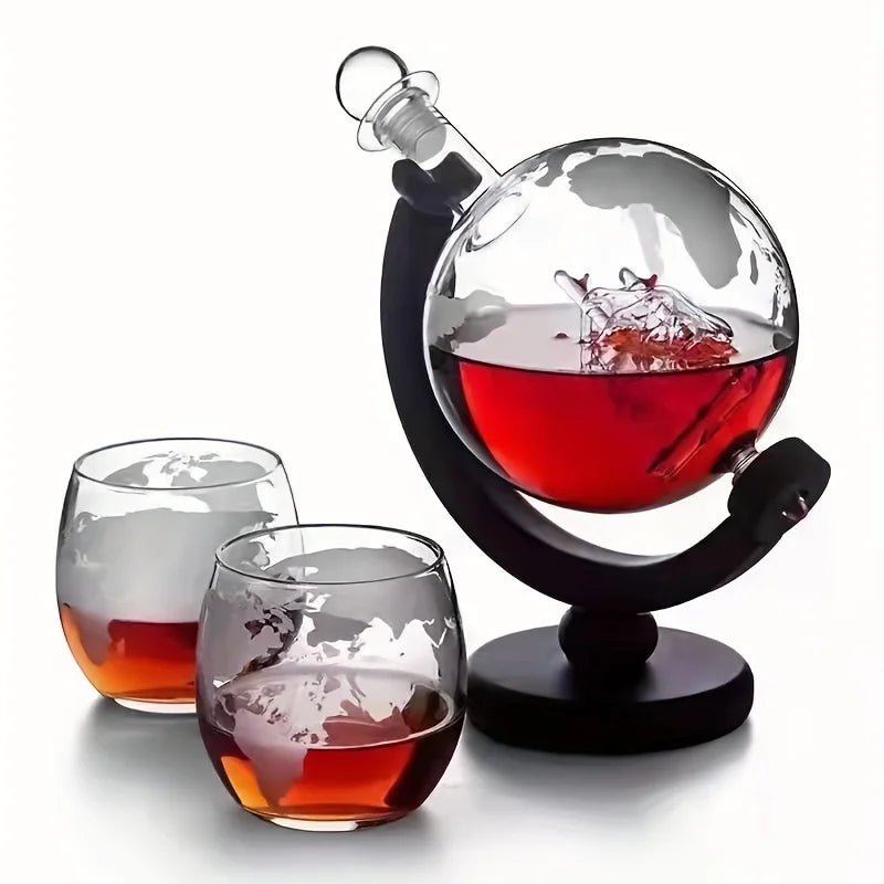 A stunning Creative Globe Decanter Set, showcasing a sophisticated lead-free carafe, set on an intricately crafted wooden stand, paired with two elegant whiskey glasses. This decanter set is not only an exquisite piece of barware, but a unique gift for whiskey lovers, globe trotters, and connoisseurs of fine craftsmanship. This globe design decanter, perched atop the beautifully constructed wood-stand, adds a touch of classic elegance and cultured refinement to any décor.