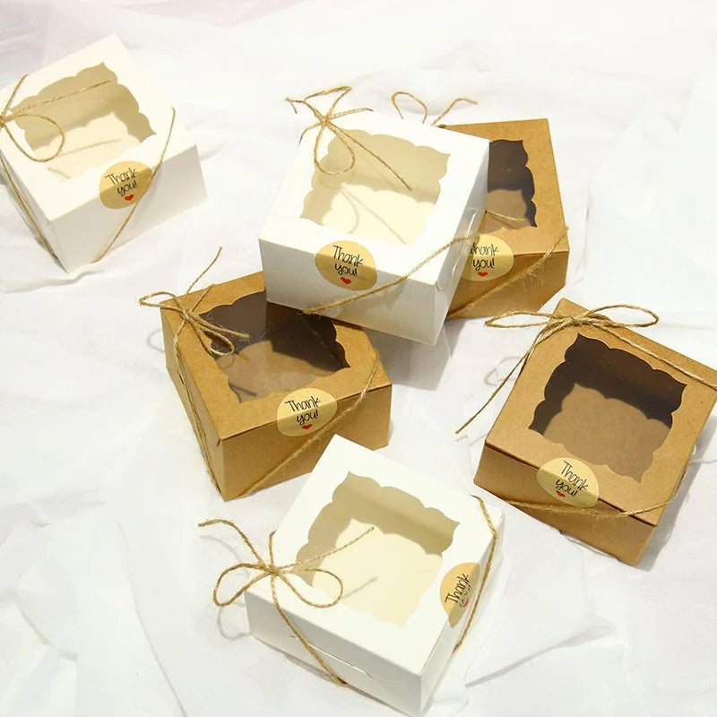 A set of 10 or 20 eco-friendly Kraft Paper Open Window Gift Box showcasing edible favors, perfectly sealed with a sticker rope, ideal for weddings, birthday parties and other special occasions. These natural toned, rustic chic boxes not only enhance the presentation of your baked goods and candies but also express the effort and love put into the gifts. Perfect for individual customizations, these boxes provide a sturdy and appealing packaging solution.