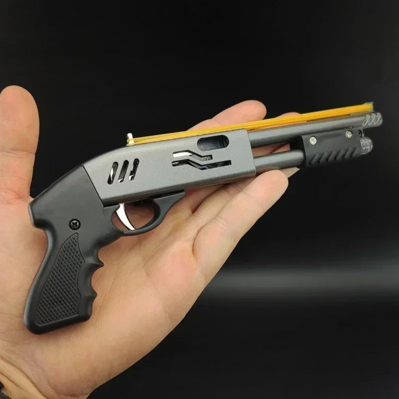 Image of a small yet highly detailed Mini Rubber Band Shotgun Sprayer. It showcases a sleek design, crafted from sturdy material with realistic features. A perfect mix of ornament and toy, it is designed to shoot 8 bursts of rubber bands guaranteeing endless fun. Suitable for both kids and adults, it aids in hand-eye coordination and motor skills. 